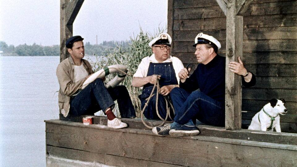 Drei Mann in einem Boot