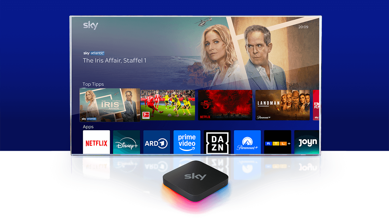 Sky Stream Box vor einem Fernseher, auf dem das Sky Stream UI zu sehen ist.